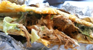 Venezuelan carne mechada inside a patacon, NYC